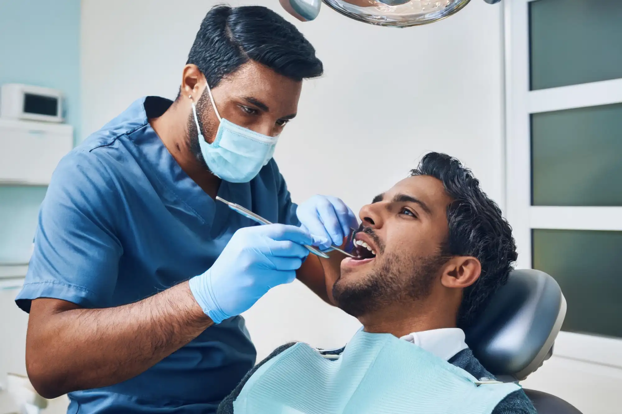 Dentist examining patient